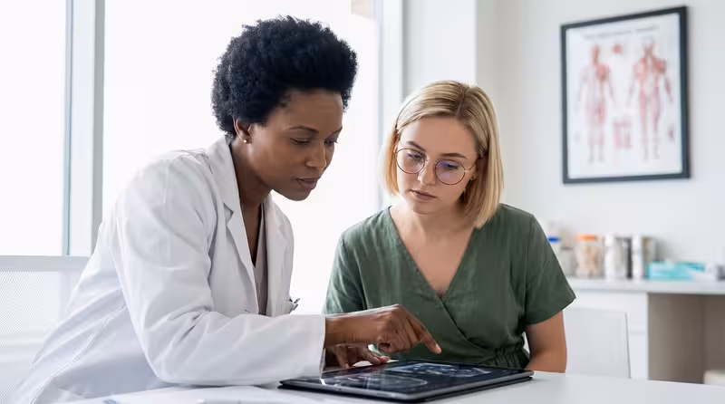 Doctor and patient consultation for Microsuction Versus Ear Syringing: Comparing Safety And Effectiveness - Private Microsuc...